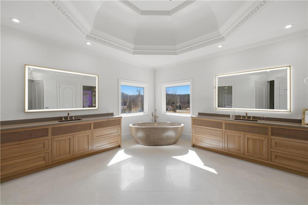 10450 Belladrum Alpharetta, GA 30022 - Photo 74 of 95 a large bathroom with a large tub and sink