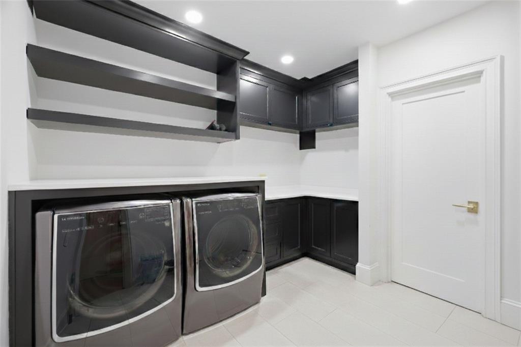 10450 Belladrum Alpharetta, GA 30022 - Photo 79 of 95 a view of a hallway with washer and dryer