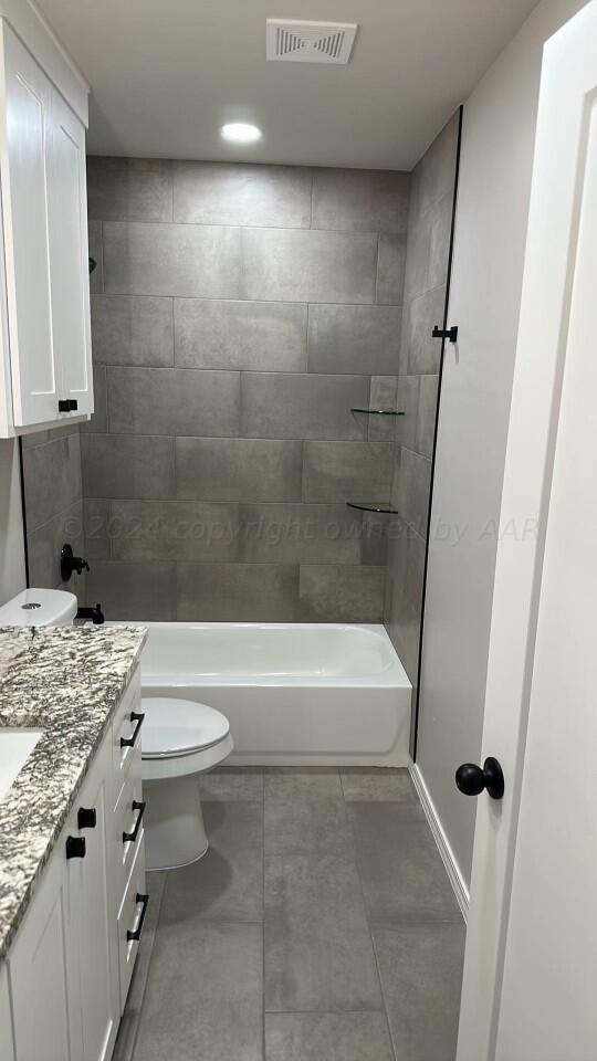 14007 Hawksbeard Place Amarillo, TX 79119 - Photo 11 of 18 a bathroom with a granite countertop sink toilet and shower