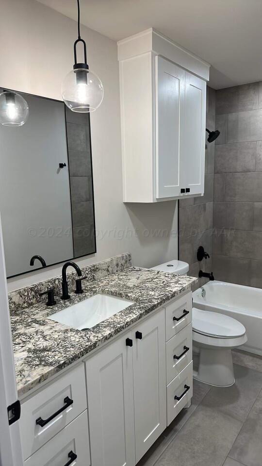 14007 Hawksbeard Place Amarillo, TX 79119 - Photo 12 of 18 a bathroom with a granite countertop sink a toilet and mirror