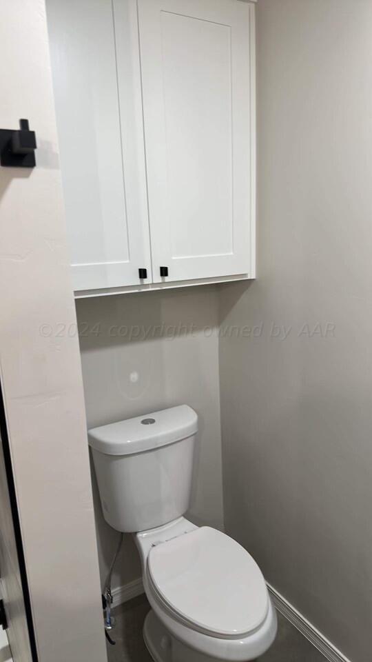 14007 Hawksbeard Place Amarillo, TX 79119 - Photo 15 of 18 a white toilet sitting next to a sink