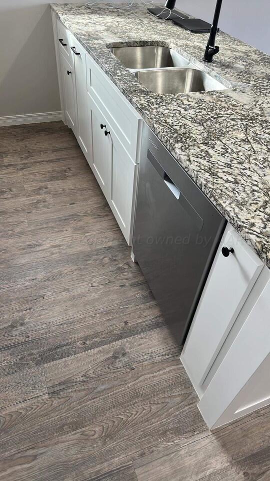 14007 Hawksbeard Place Amarillo, TX 79119 - Photo 4 of 18 a kitchen with a sink and a stove
