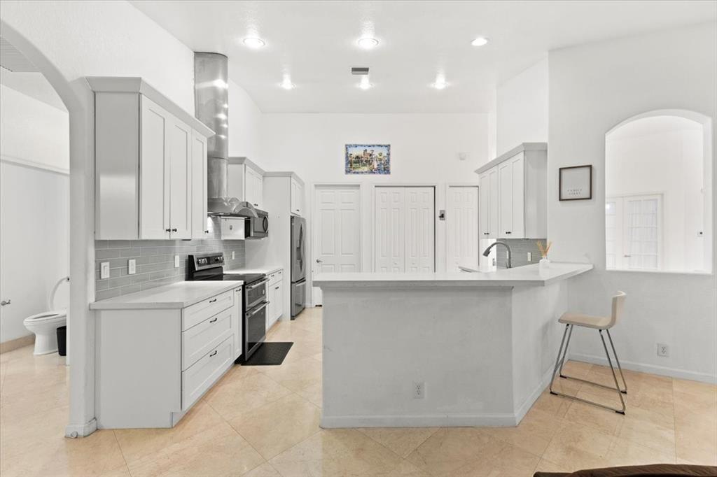 Undisclosed Address Davie, FL 33314 - Photo 11 of 38 a kitchen with white cabinets and sink