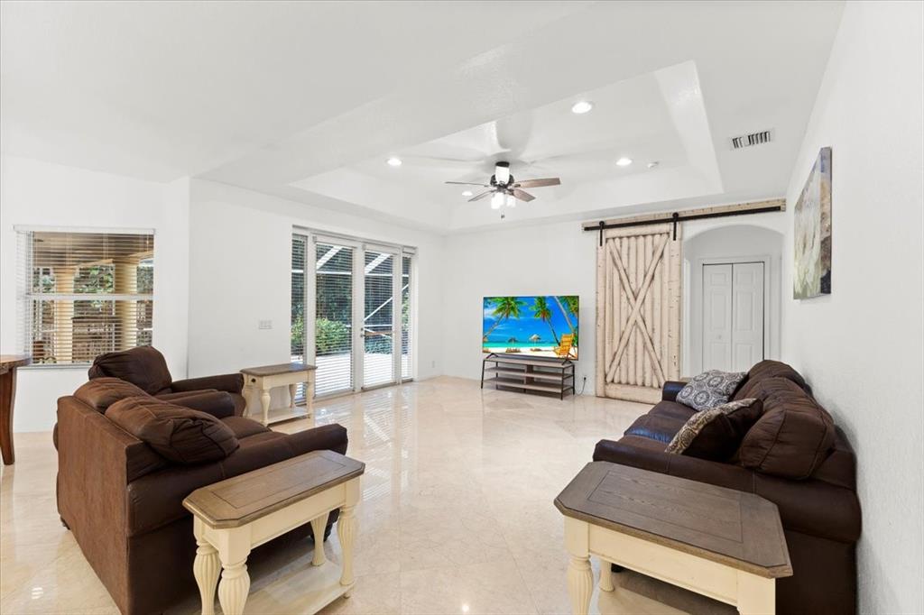 Undisclosed Address Davie, FL 33314 - Photo 12 of 38 a living room with furniture and a flat screen tv