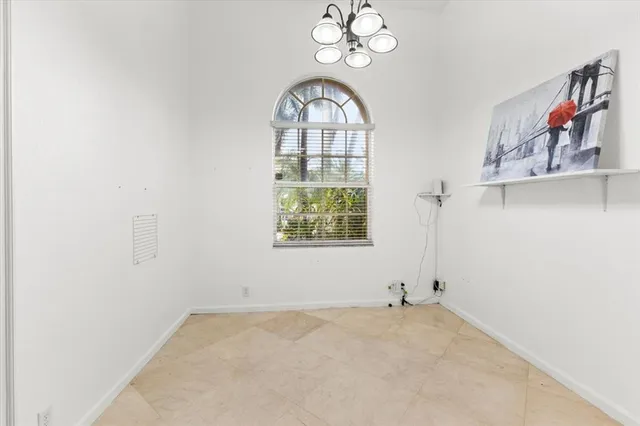 a spacious bedroom with a bed and window