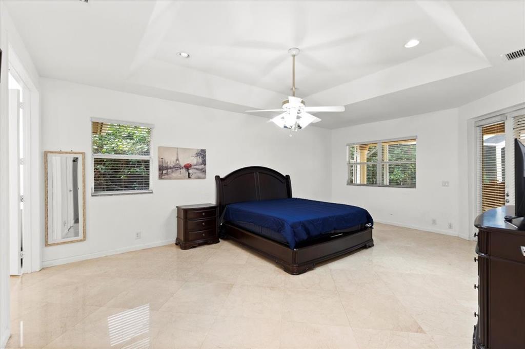 Undisclosed Address Davie, FL 33314 - Photo 17 of 38 a spacious bedroom with a bed and window