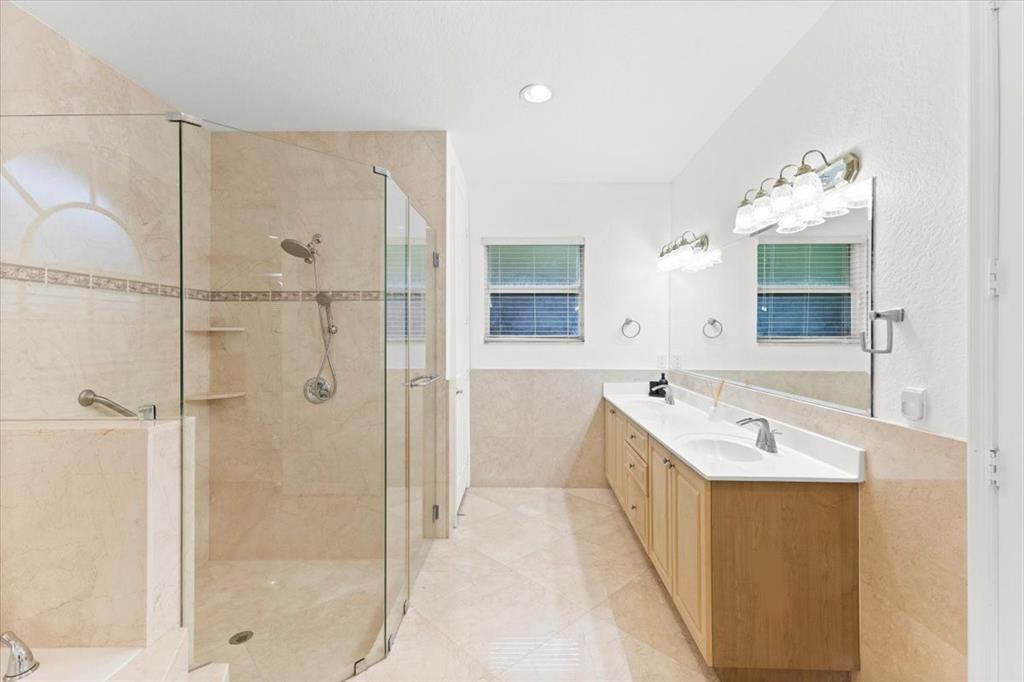 Undisclosed Address Davie, FL 33314 - Photo 21 of 38 a bathroom with a double vanity sink mirror and shower