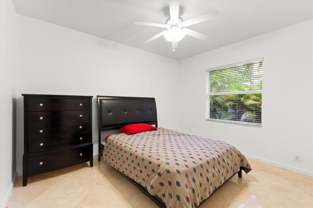 Undisclosed Address Davie, FL 33314 - Photo 22 of 38 a bedroom with a bed and a closet