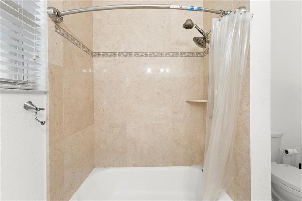 Undisclosed Address Davie, FL 33314 - Photo 24 of 38 a bathroom with a glass shower door