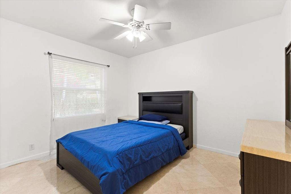 Undisclosed Address Davie, FL 33314 - Photo 25 of 38 a bedroom with a bed and window