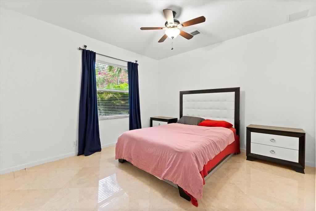 Undisclosed Address Davie, FL 33314 - Photo 27 of 38 a bedroom with a bed and a window