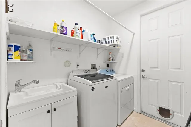 a front view of a house with a yard and a garage