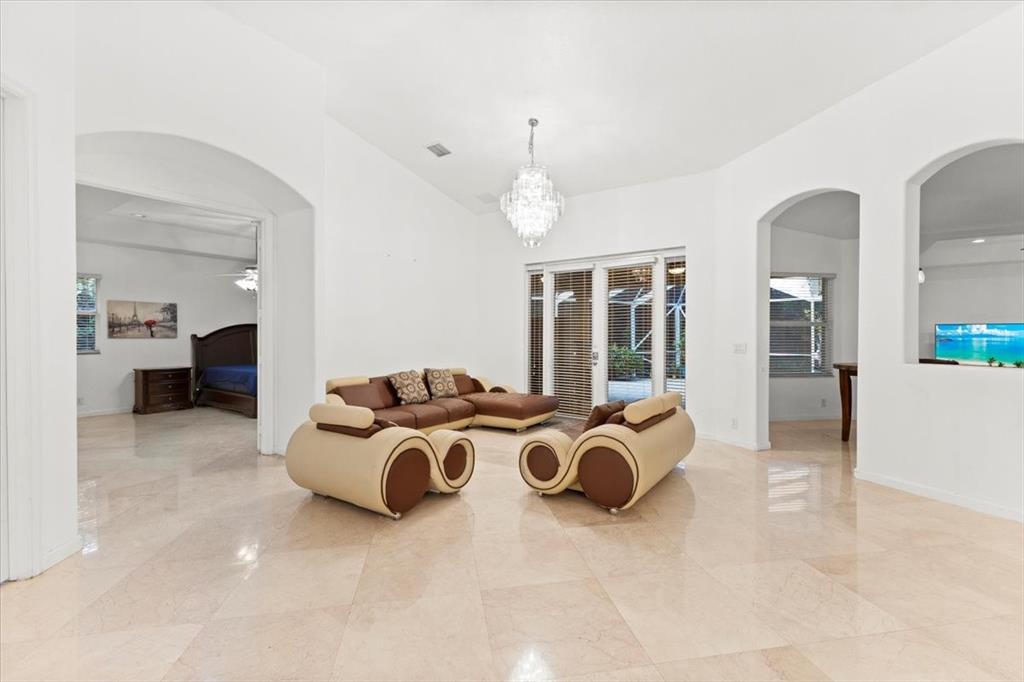 Undisclosed Address Davie, FL 33314 - Photo 3 of 38 a spacious bedroom with a bed and glass door