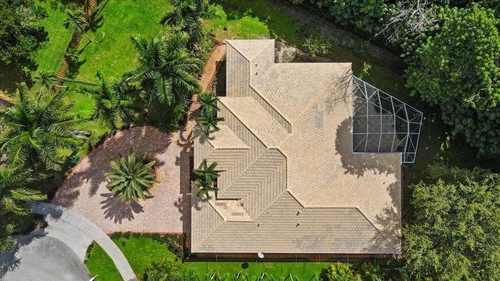 Undisclosed Address Davie, FL 33314 - Photo 32 of 38 an aerial view of a house with a yard and potted plants