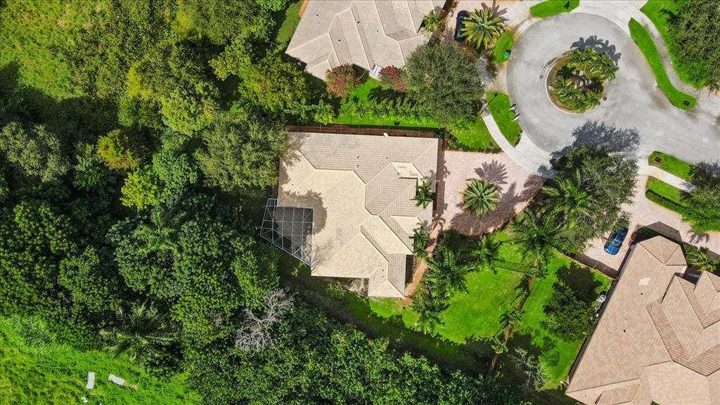 Undisclosed Address Davie, FL 33314 - Photo 33 of 38 an aerial view of a house with a yard and a large pool