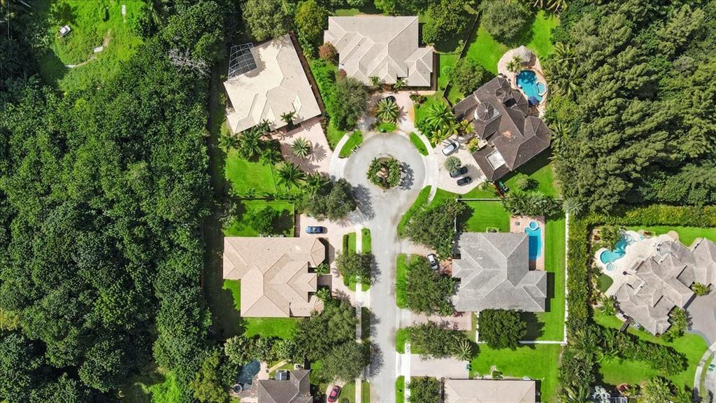 Undisclosed Address Davie, FL 33314 - Photo 37 of 38 an aerial view of a house with a yard and trees