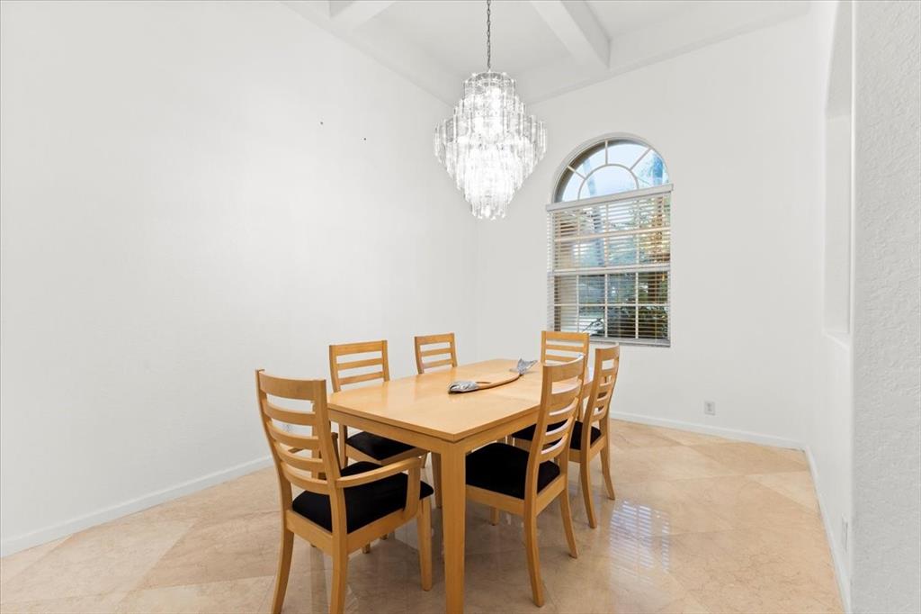 Undisclosed Address Davie, FL 33314 - Photo 7 of 38 a view of a dining room with furniture and chandelier
