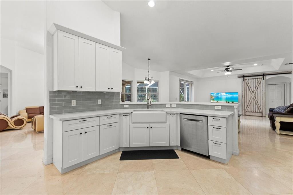 Undisclosed Address Davie, FL 33314 - Photo 9 of 38 a kitchen with sink cabinets and white appliances