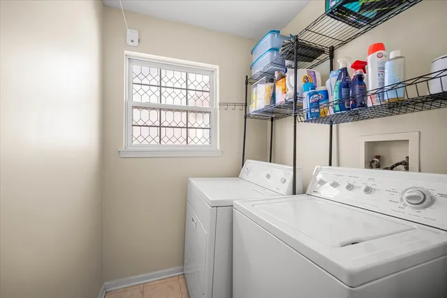 a view of storage and utility room with washer and dryer
