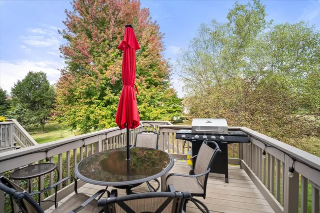a view of a chairs and table in the balcony