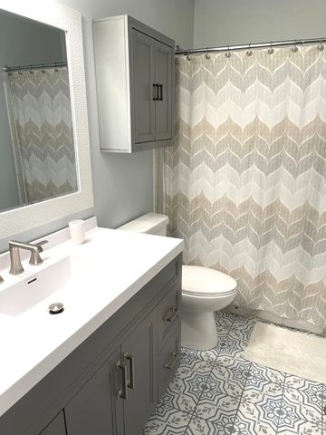 a kitchen with stainless steel appliances a stove a sink and a refrigerator