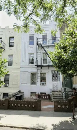 a front view of a house with parking