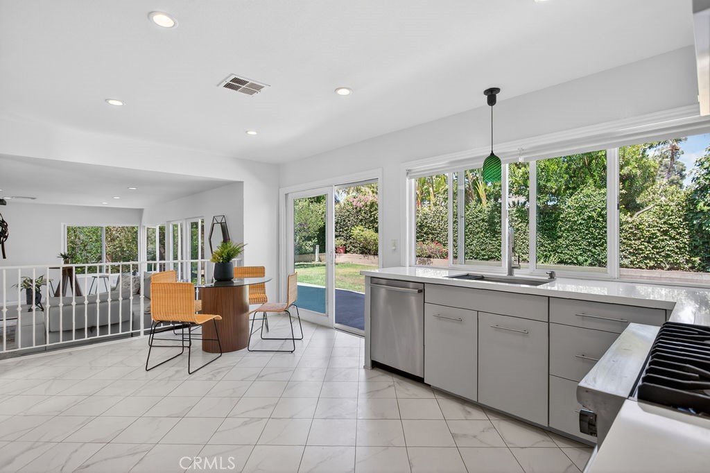 1663 North Yurok Street Orange, CA 92867 - Photo 12 of 31 a large kitchen with a table and chairs in it