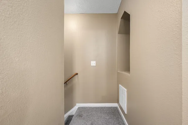 a view of hallway with closet