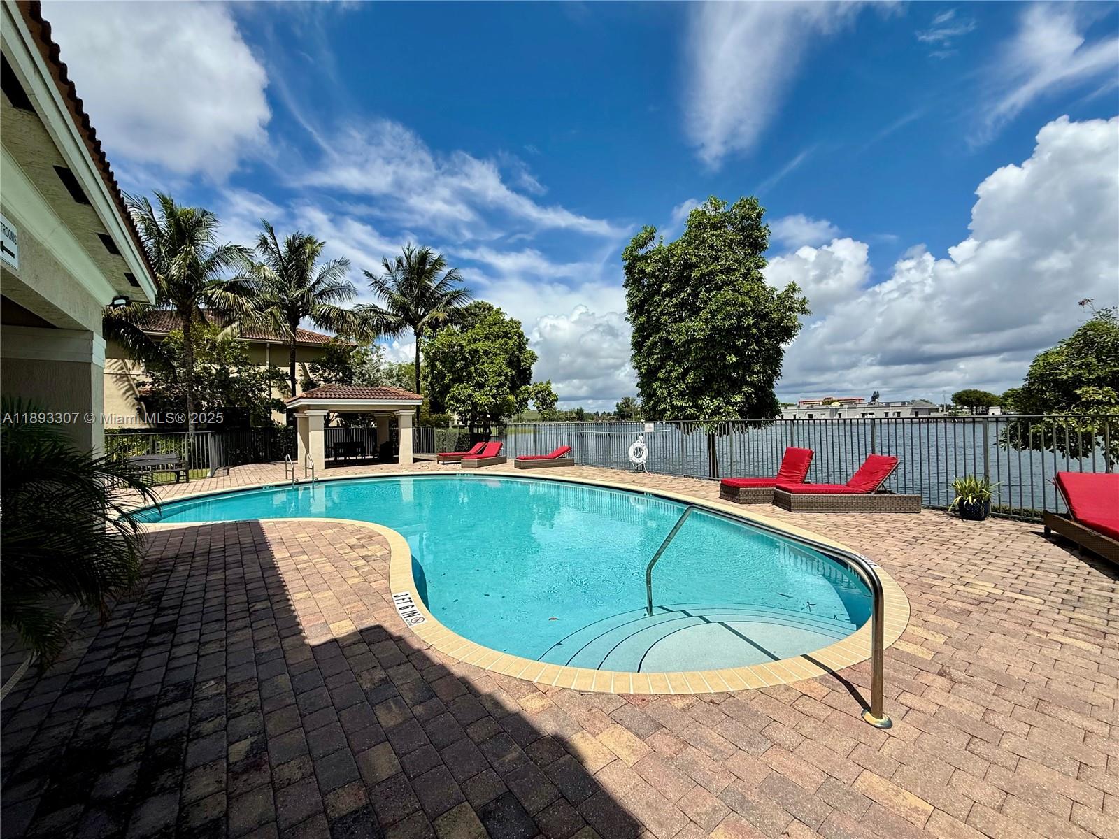 1075 Northwest 33rd Manor Pompano Beach, FL 33064 - Photo 24 of 27 a view of outdoor space deck and kitchen