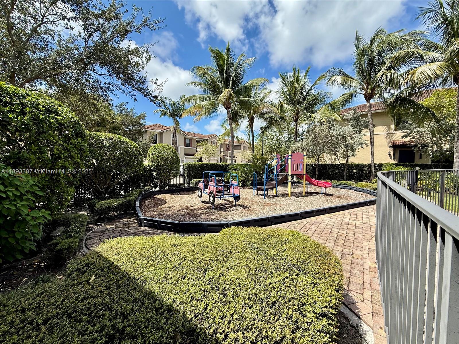 1075 Northwest 33rd Manor Pompano Beach, FL 33064 - Photo 25 of 27 a view of a swimming pool with a patio