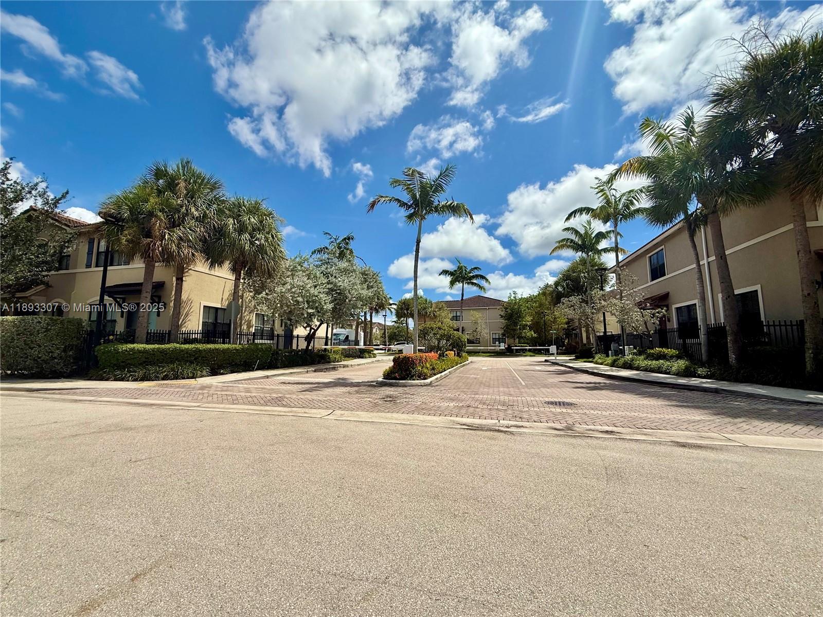 1075 Northwest 33rd Manor Pompano Beach, FL 33064 - Photo 27 of 27 a view of street with houses