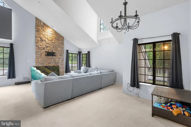 a living room with furniture and windows