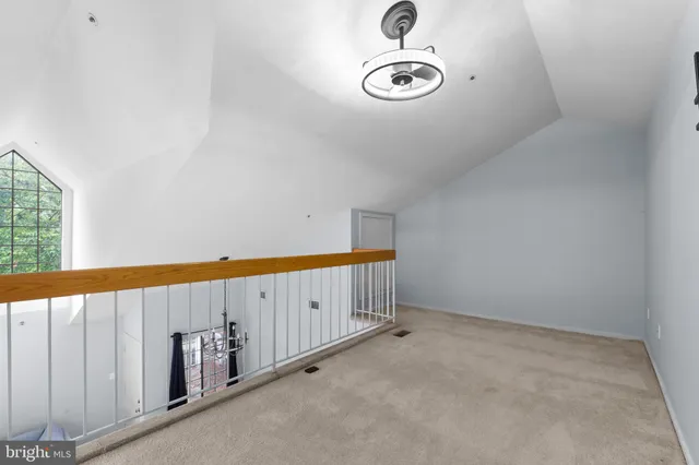 a view of a hallway with staircase