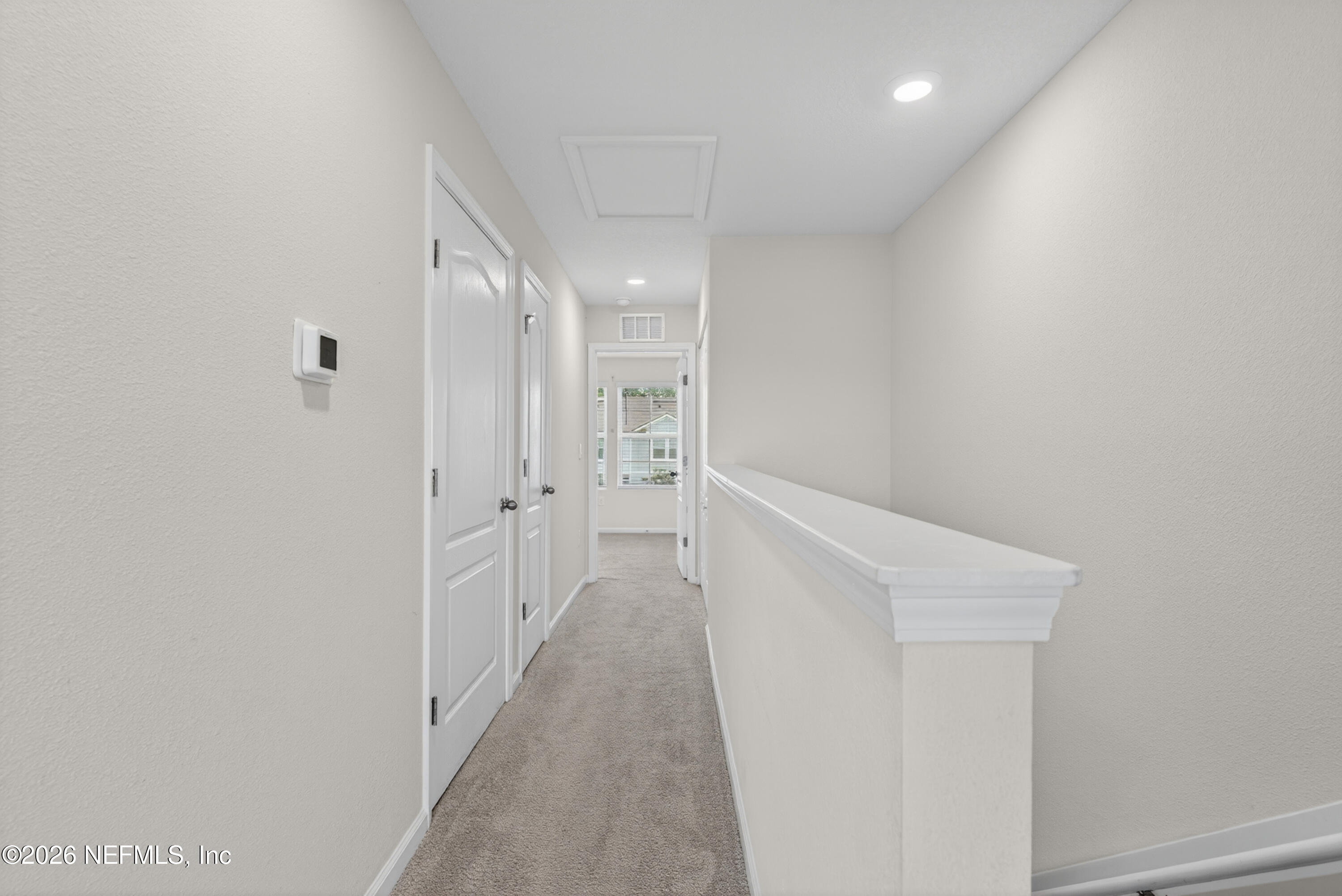 8210 Larose Road Jacksonville, FL 32211 - Photo 17 of 38 a view of a hallway with white walls