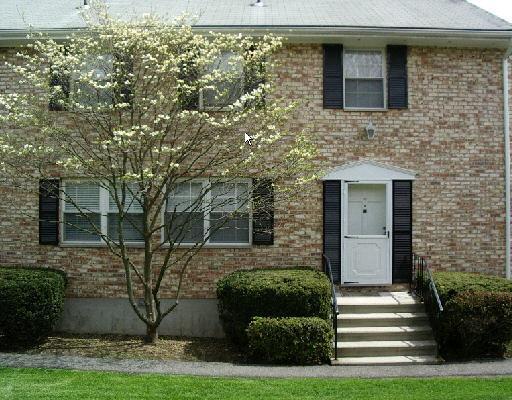 39 Woodway Road, Unit C9 Stamford, CT 06907 - Photo 1 of 1 a front view of a house with garden