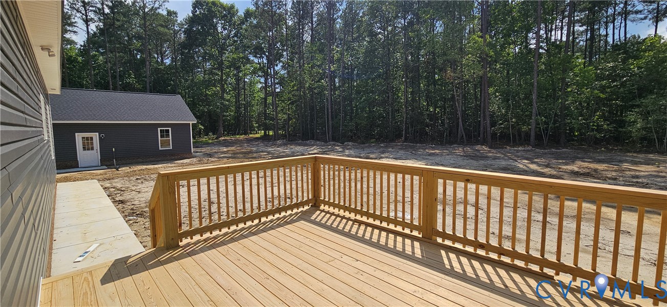 2982 Ashdale Road Center Cross, VA 22437 - Photo 9 of 17 Spacious wood deck with natural wood railing, prov