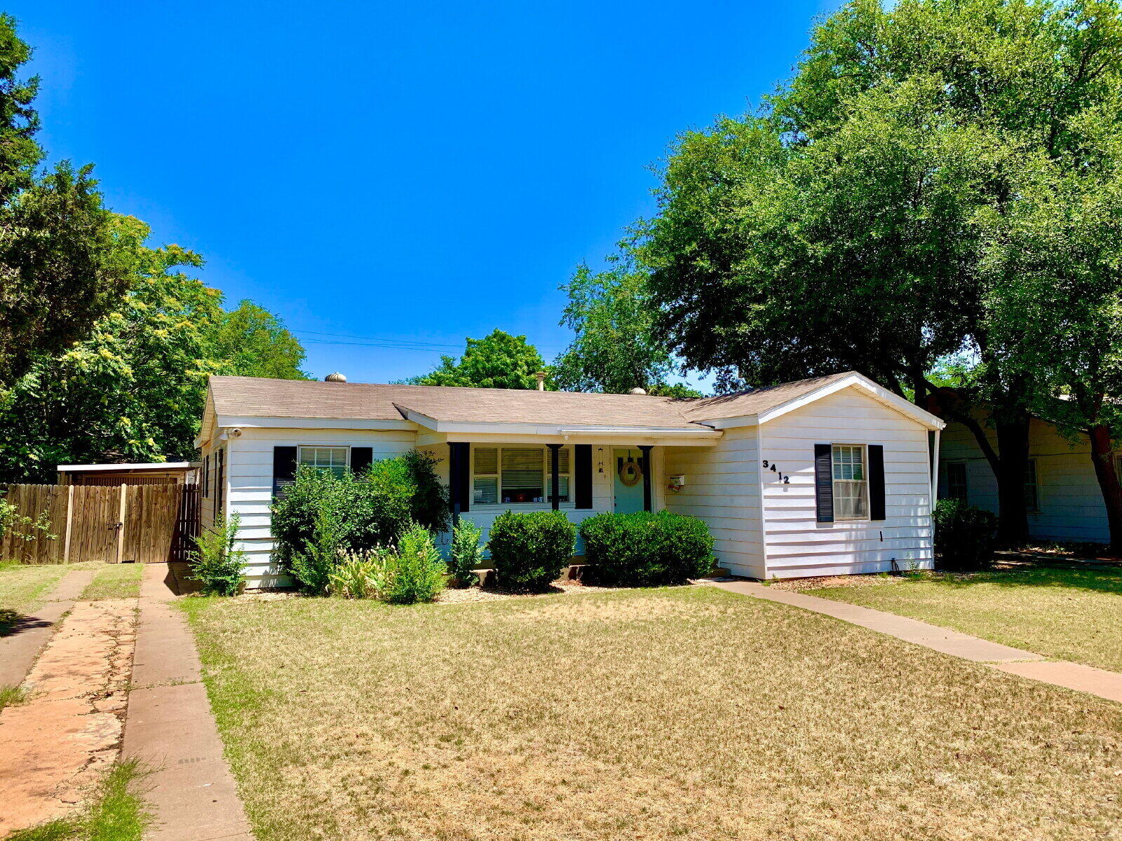 3412 30th Street Lubbock, TX 79410 - Photo 14 of 14 a front view of a house with a yard