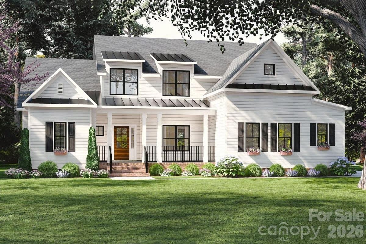 10131 Jim Sossoman Road, Unit 15 Midland, NC 28107 - Photo 1 of 1 front view of a house with a yard