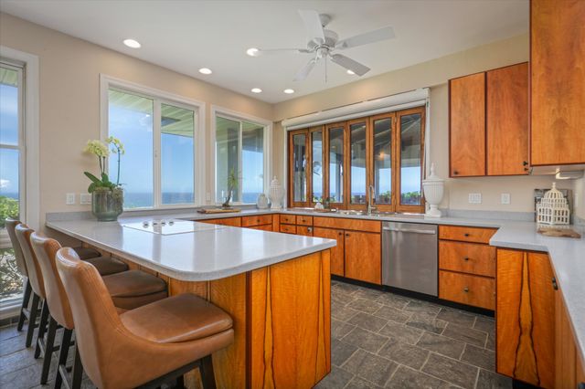 a dining table with chairs and window