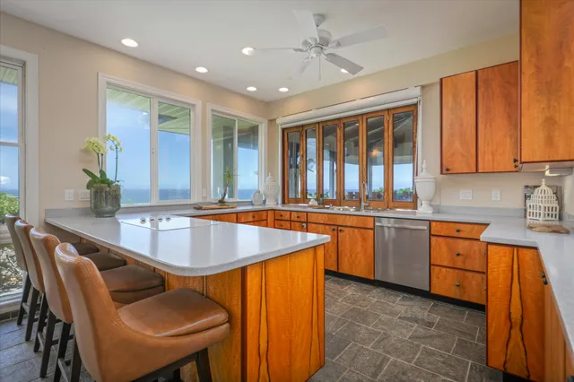 a dining table with chairs and window