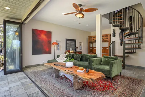 a living room with furniture and a rug