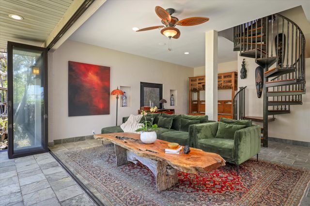 a living room with furniture and a rug