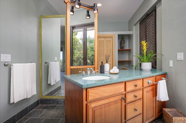 a bathroom with sinks a mirror and a shower