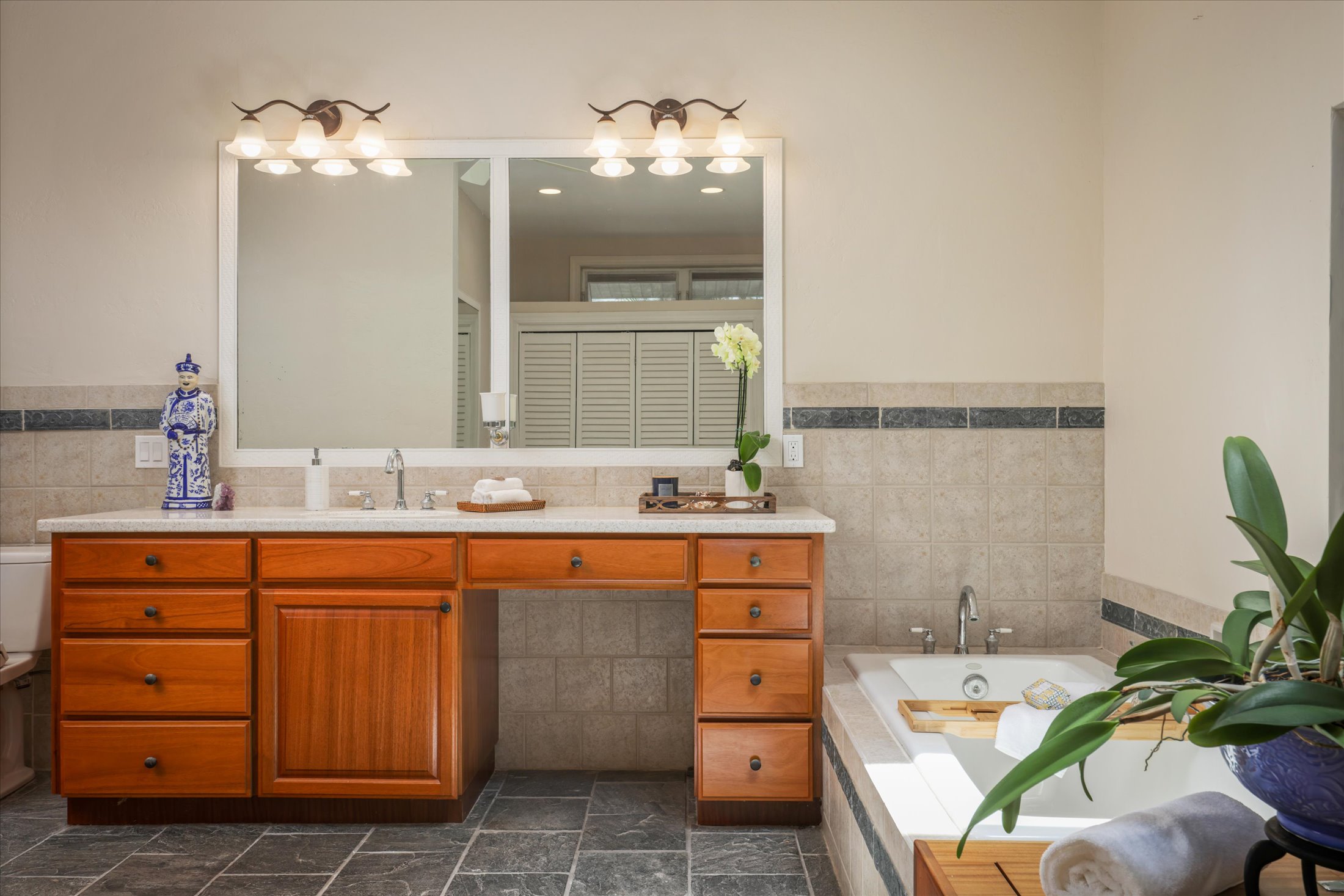 95-4667 Hawaii Belt Road Naalehu, HI 96772 - Photo 22 of 30 a bathroom with a sink and a mirror