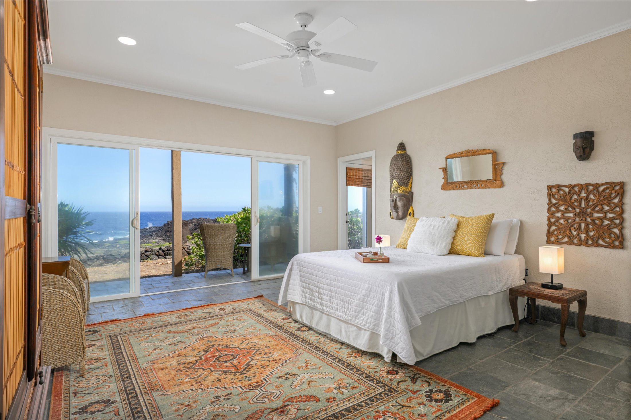 95-4667 Hawaii Belt Road Naalehu, HI 96772 - Photo 26 of 30 a bedroom with a large bed and a large window
