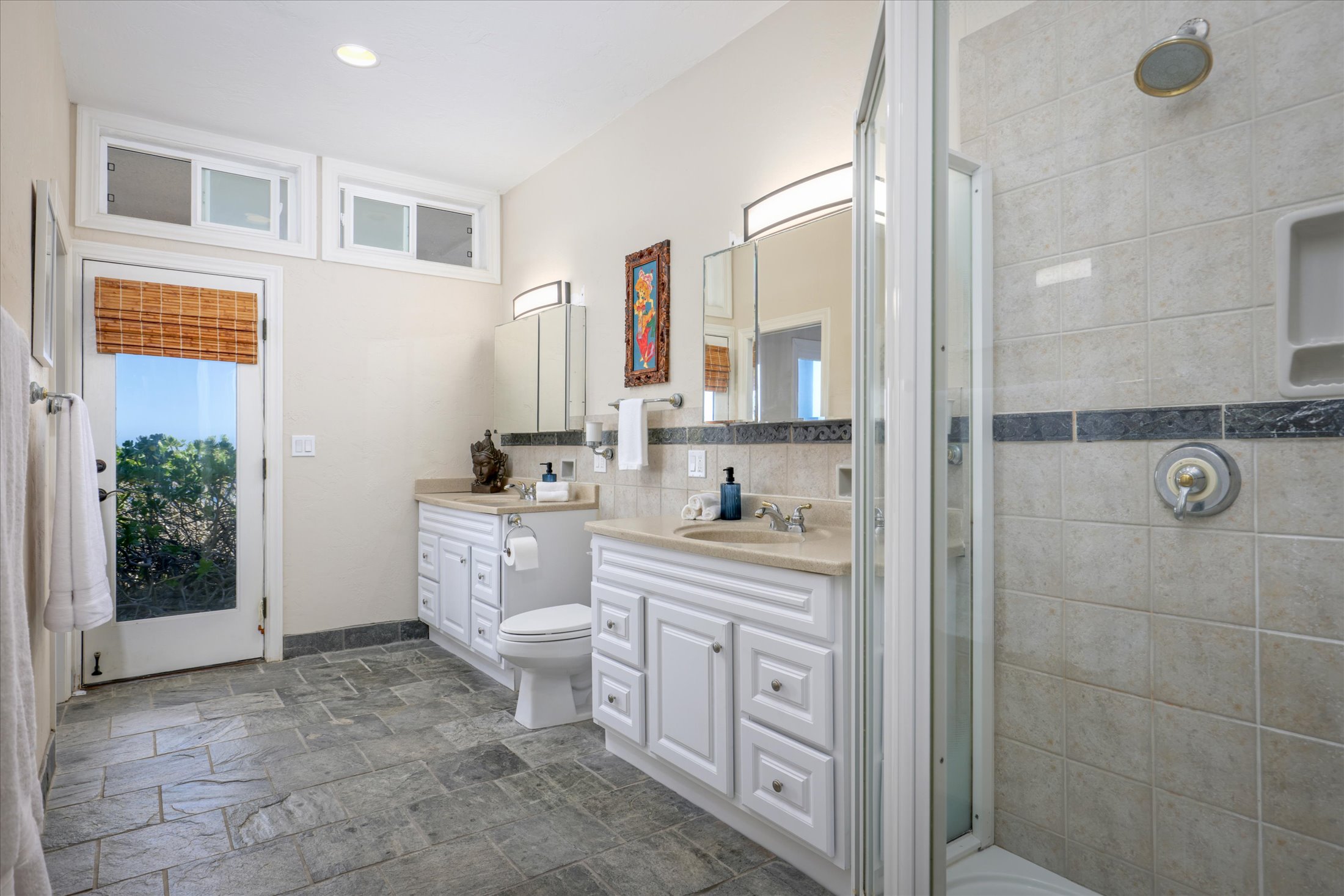 95-4667 Hawaii Belt Road Naalehu, HI 96772 - Photo 27 of 30 a bathroom with a sink a toilet and shower