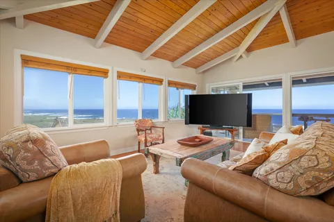 a bedroom with furniture and a flat screen tv