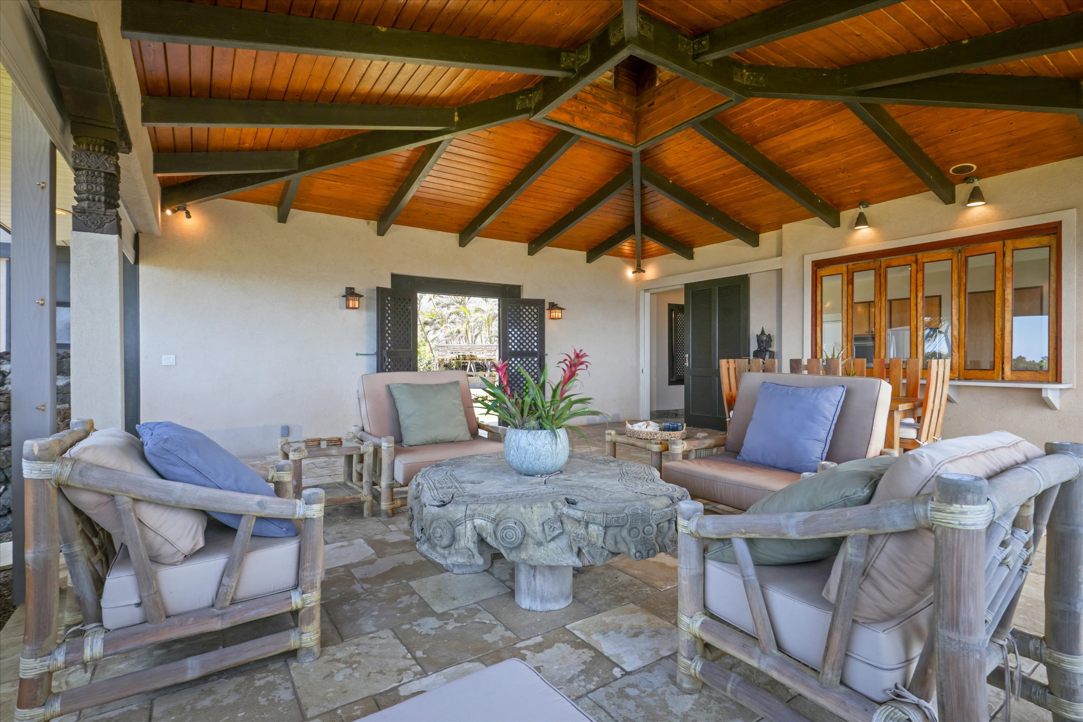 95-4667 Hawaii Belt Road Naalehu, HI 96772 - Photo 10 of 30 a outdoor space with the couches and dining table