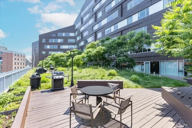 a view of a chairs and table in backyard of the house