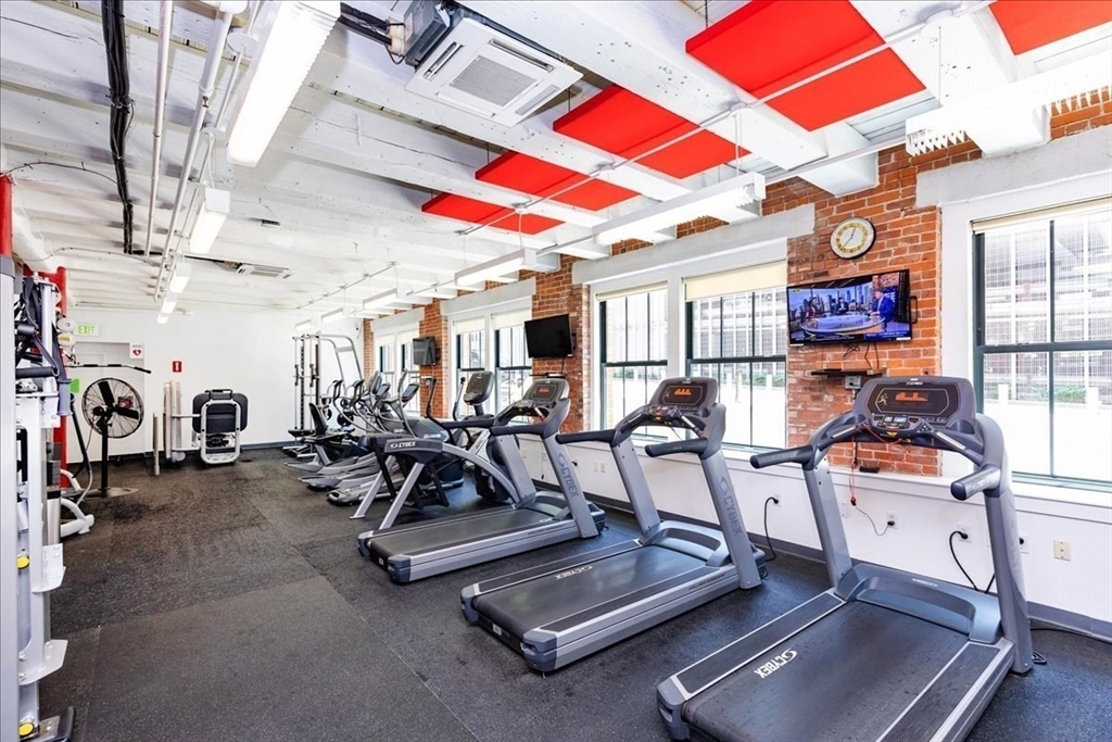 9 West Broadway, Unit 206 Boston, MA 02127 - Photo 21 of 25 a view of a room with gym equipment